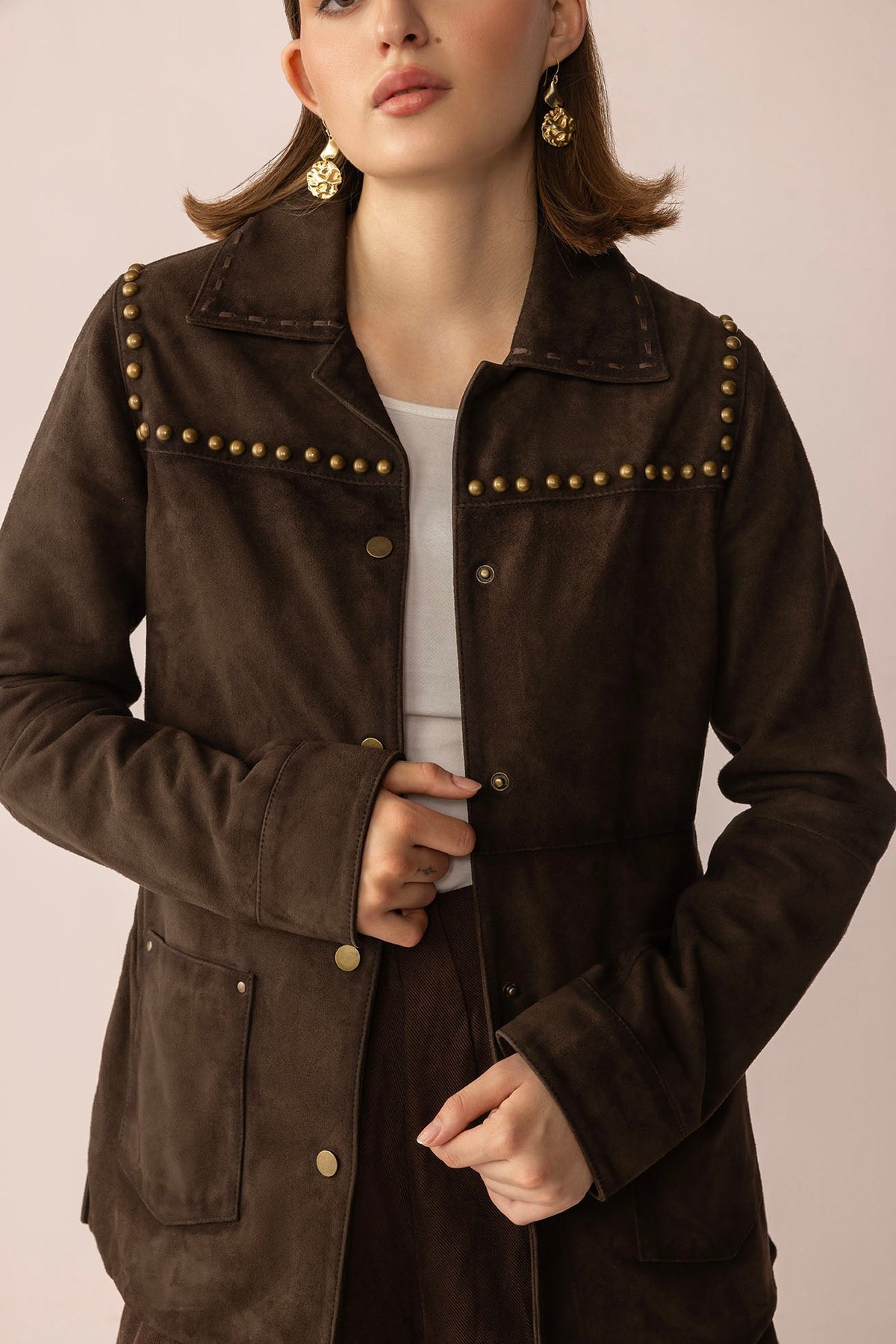 Myra USA Grit & Glisten Leather Jacket in Shadow Brown, close-up of stylish leather jacket with textured finish and collar detail.