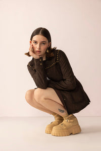Myra USA leather jacket in shadow brown with a sleek design, showcasing the Grit & Glisten style in a close-up view.