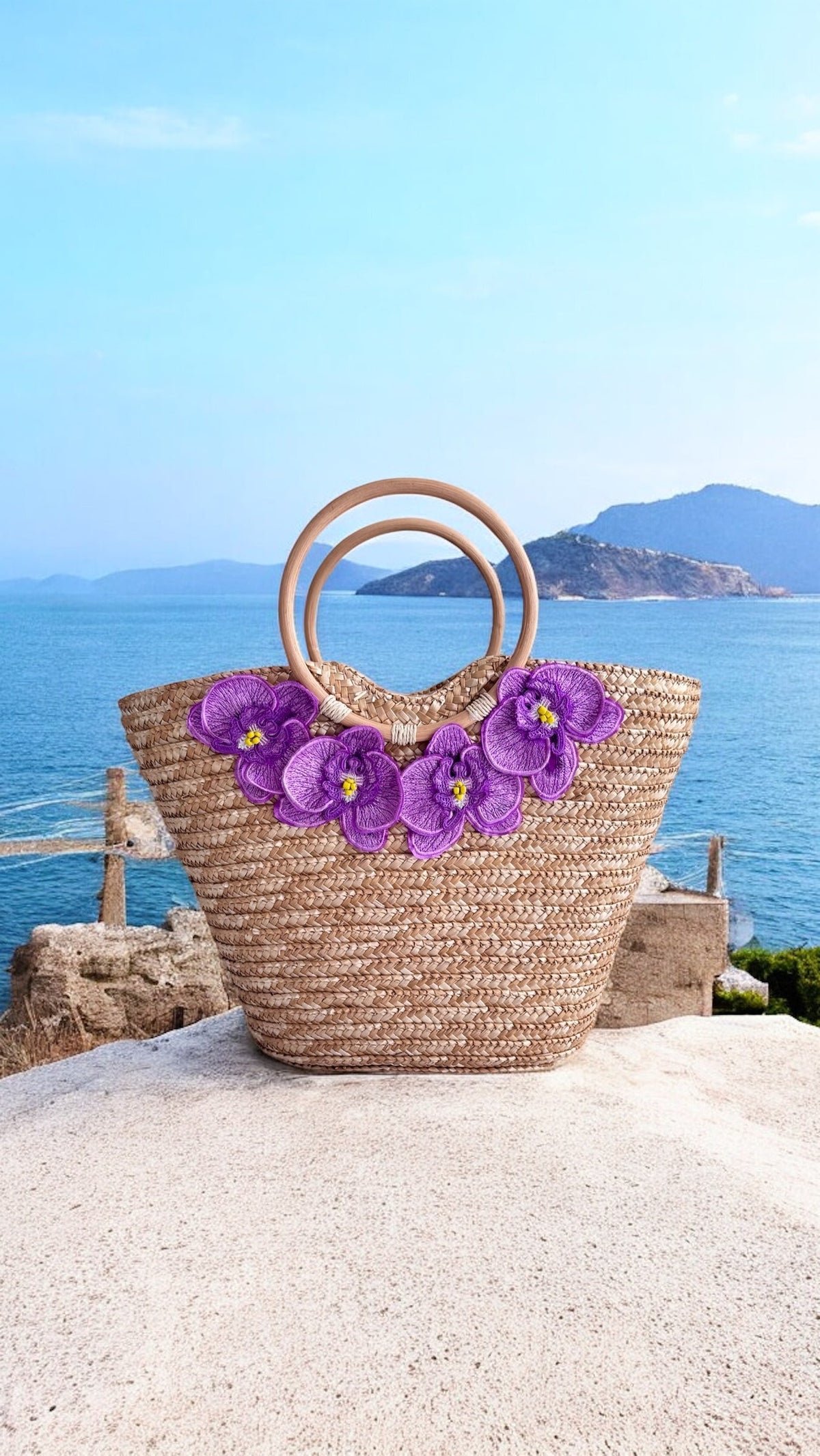 NIKOZA Goddess in Lilac Straw Beach Bag with woven texture and floral design, perfect for summer seaside outings.