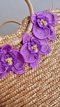 NIKOZA Goddess in Lilac Straw Beach Bag with woven design and shoulder strap, perfect for summer outings.