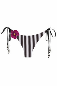 White NIKOZA Lycaste bikini bottom lying flat, showing the sleek, minimal design and smooth fabric perfect for swimwear.