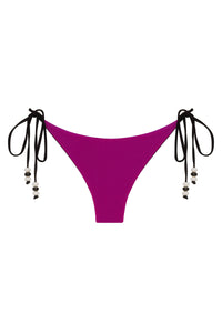 Reversible pink and black Cattleya bikini bottom by NIKOZA with tie sides, shown in a swimwear image.