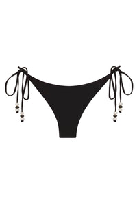 Reversible black and pink Cattleya bikini bottom by NIKOZA with tie sides, shown on a model.