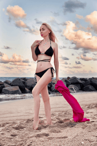NIKOZA Cattleya bikini bottom in fuchsia and black, reversible tie-side swimwear for women.