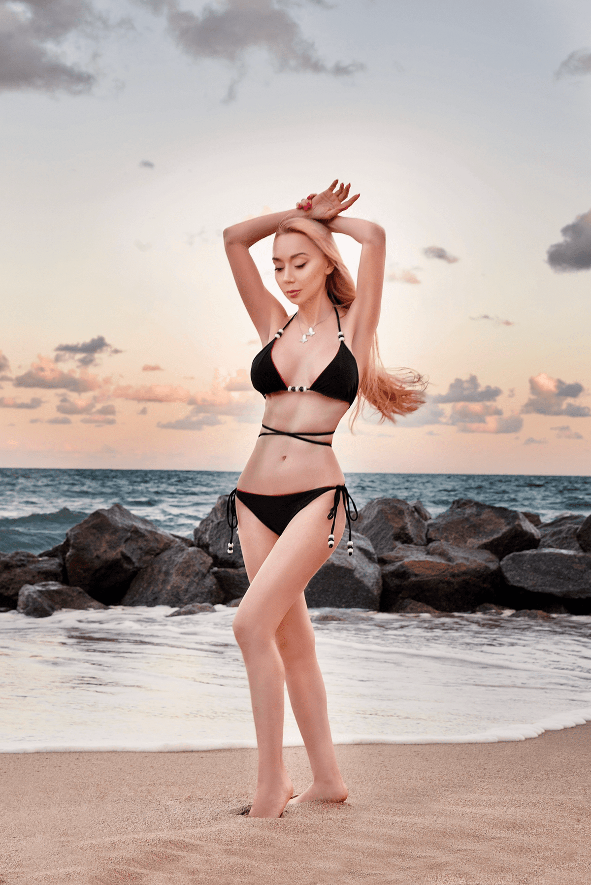Reversible fuchsia and black Cattleya bikini bottom by NIKOZA with tie-side design and comfortable fit.