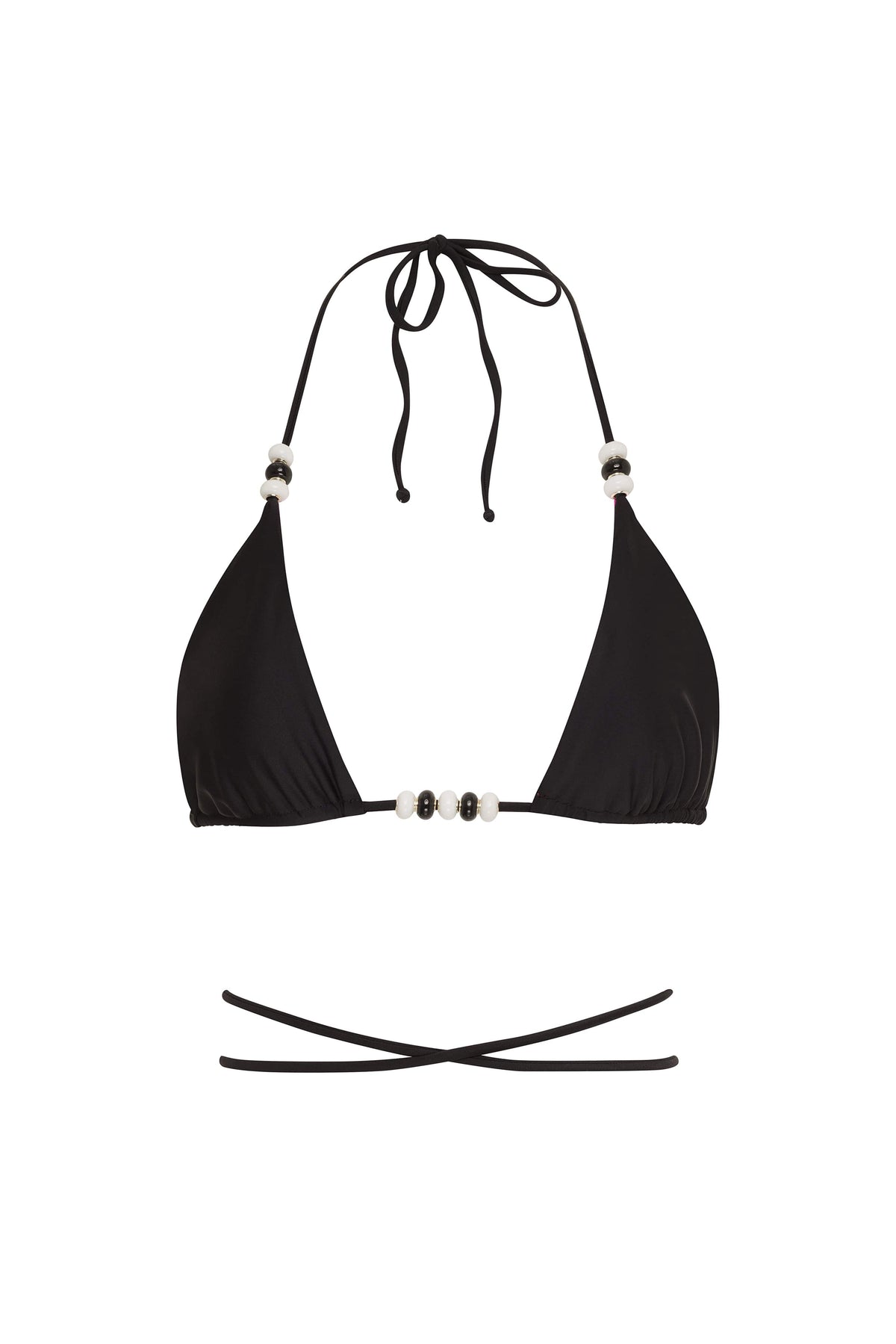 Reversible Cattleya bikini bottom by NIKOZA in fuchsia and black with tie sides, shown on a model.