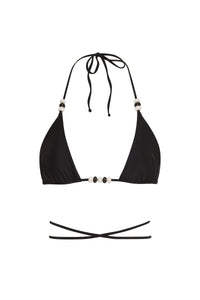 Reversible Cattleya bikini bottom by NIKOZA in fuchsia and black with tie sides, shown on a model.