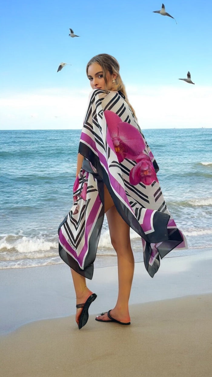 NIKOZA Phalaenopsis silk cover-up tunic featuring a flowing, elegant design with floral print and lightweight, breathable fabric.