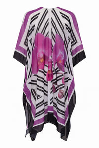 White Phalaenopsis silk cover-up tunic by NIKOZA featuring a flowing, lightweight design for elegant beachwear.