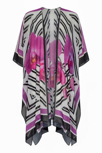 White Phalaenopsis silk cover-up tunic by NIKOZA, featuring a flowing design and floral pattern, perfect as a stylish swimwear cover-up.