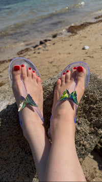 NIKOZA ALIANA clear gel beach sandals featuring transparent straps and cushioned soles, perfect for casual beachwear.