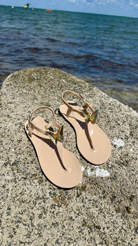 NIKOZA ALIANA clear gel beach sandals with transparent straps and flat sole, perfect for casual summer wear.