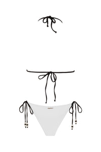 NIKOZA Lycaste striped top displayed on a hanger with a close-up view of the fabric and pattern.