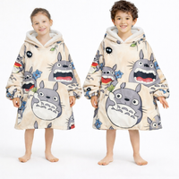 Adult and kid-sized My Neighbor Totoro wearable blanket hoodie by Olm Collectibles, featuring soft fabric and Totoro design.