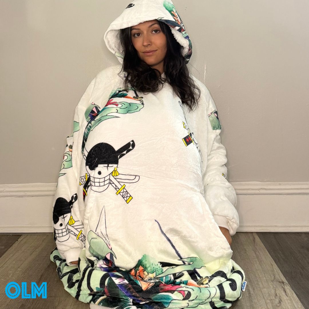 Olm Collectibles Zoro One Piece wearable blanket hoodie for kids and adults, featuring character design and cozy fabric.