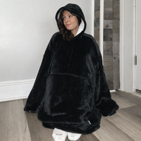 Black wearable Sherpa blanket hoodie by Olm Collectibles, oversized for kids and adults, cozy and warm with soft fleece material.