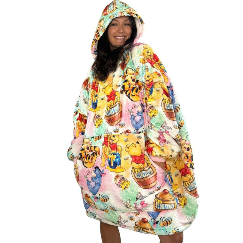Olm Collectibles Winnie the Pooh & Friends wearable blanket hoodie for kids and adults, featuring soft, cozy fleece with character print.