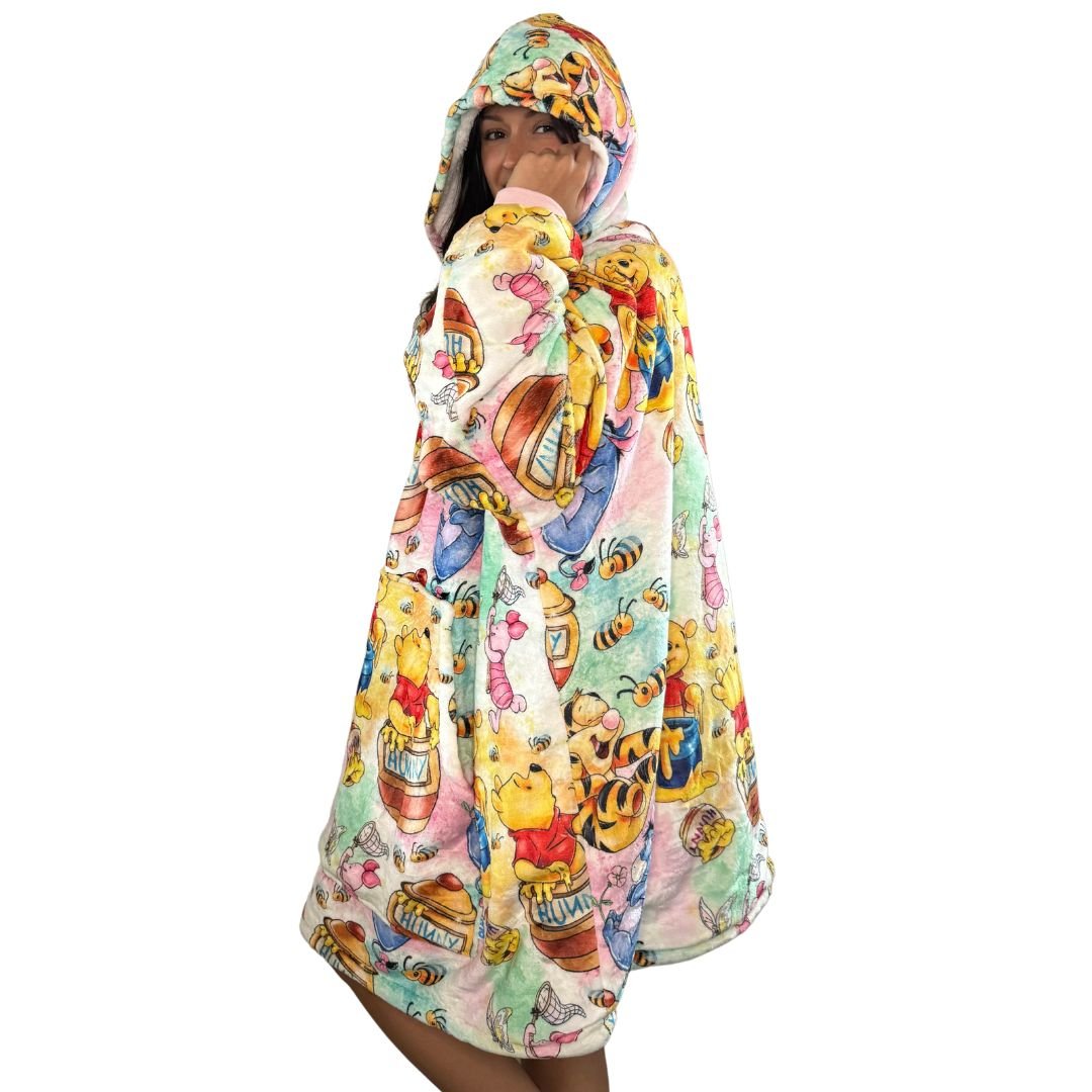 Olm collectibles Winnie the Pooh & Friends wearable blanket hoodie for kids and adults, featuring soft, cozy fabric with cartoon character prints.