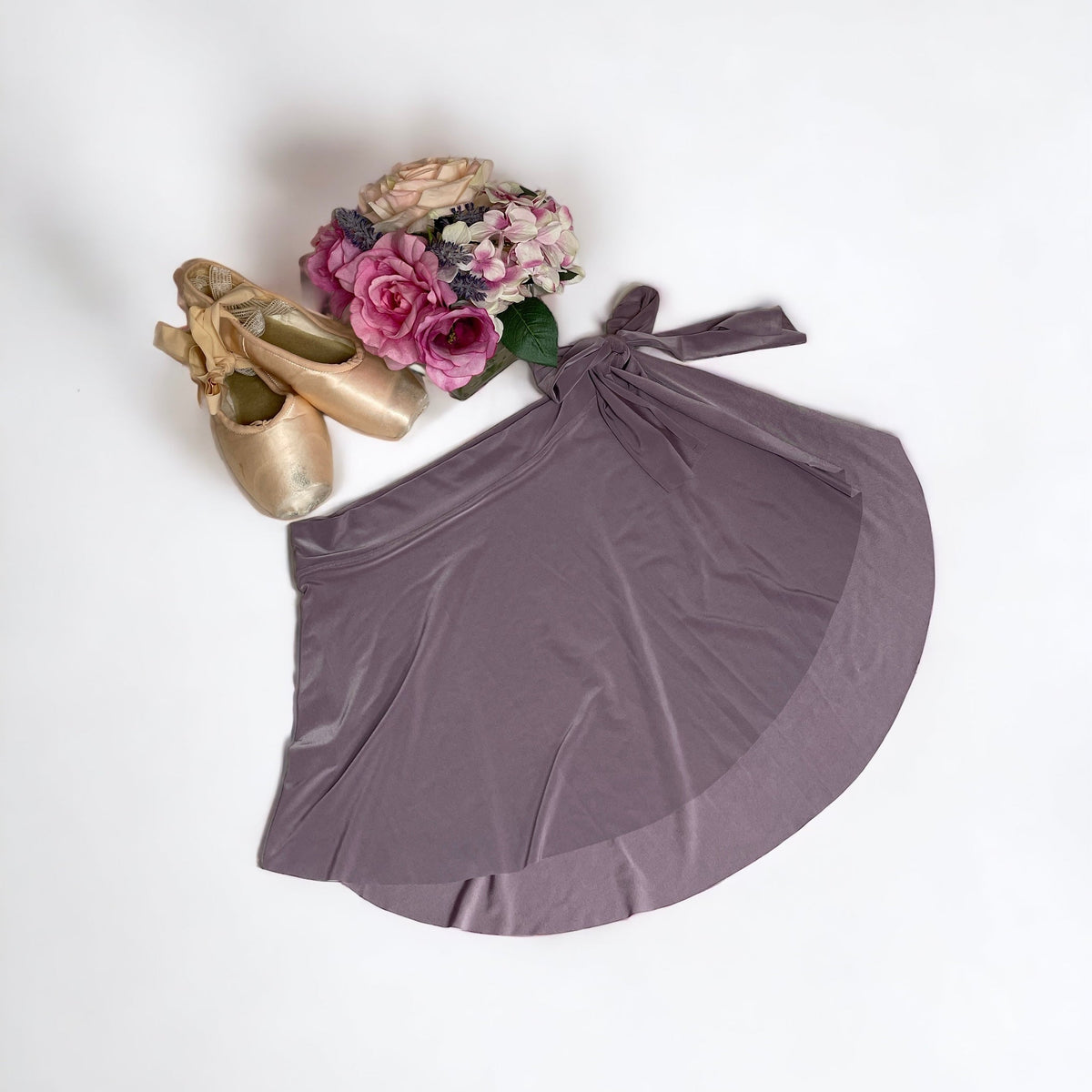 Light purple ballet wrap skirt by oodelooo Ballet Wear, lavender mist demi skirt for women, shown on model.