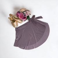 Light purple ballet wrap skirt by oodelooo Ballet Wear, lavender mist demi skirt for women, shown on model.