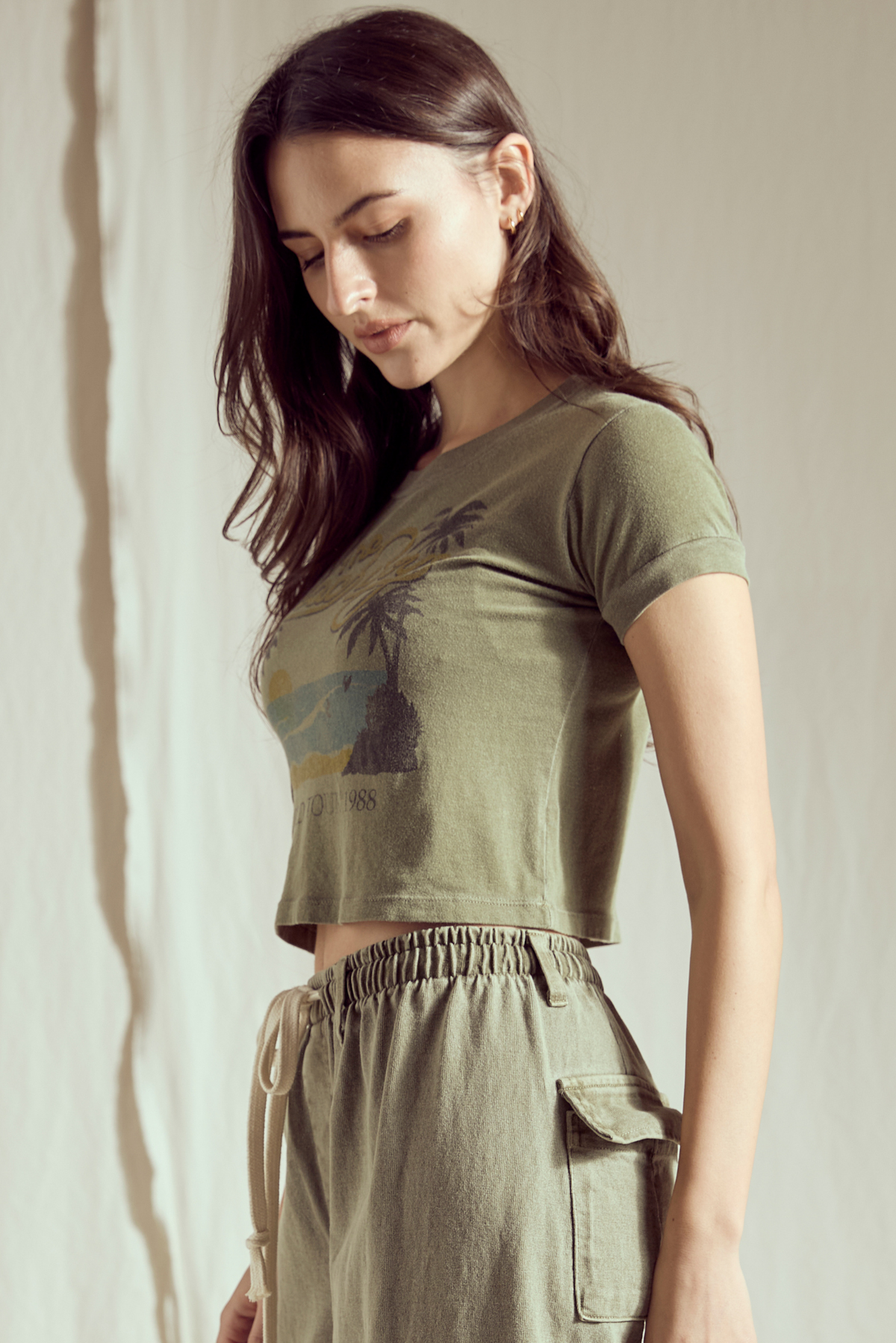 People of Leisure California Dreamin' Baby Tee top featuring vintage-style graphic print on soft fabric, casual summer fashion.