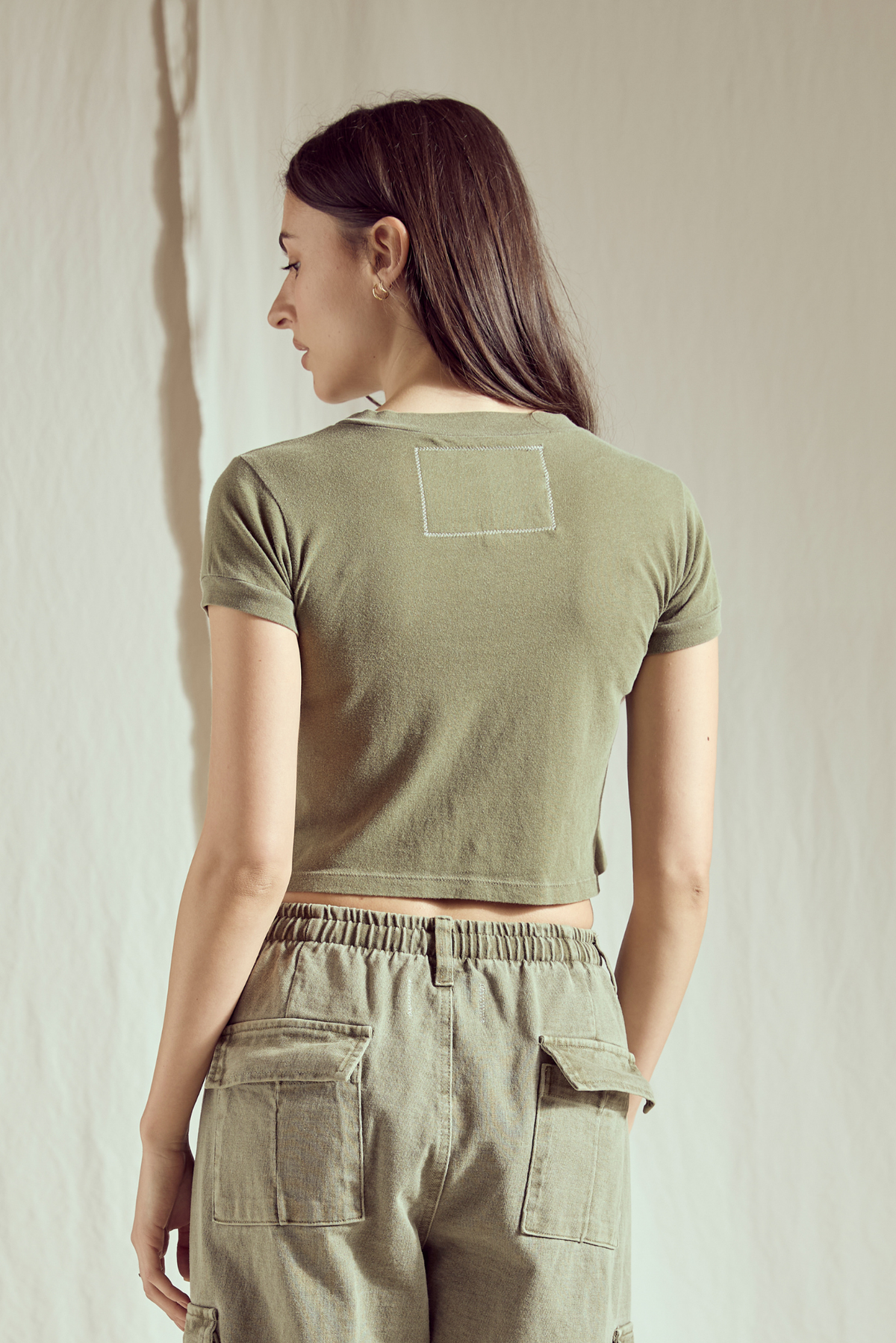People of Leisure California Dreamin' Baby Tee top featuring vintage-inspired beach and sunset graphic design.