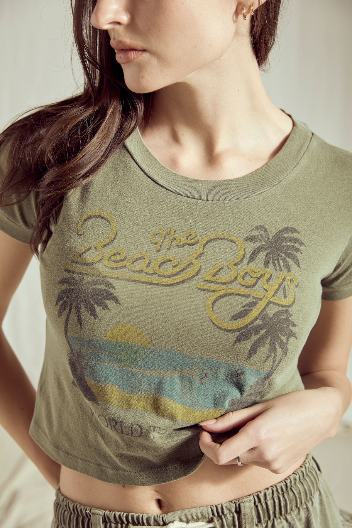 People of Leisure California Dreamin' Baby Tee top with vintage-style beach scene graphic on soft cotton fabric.