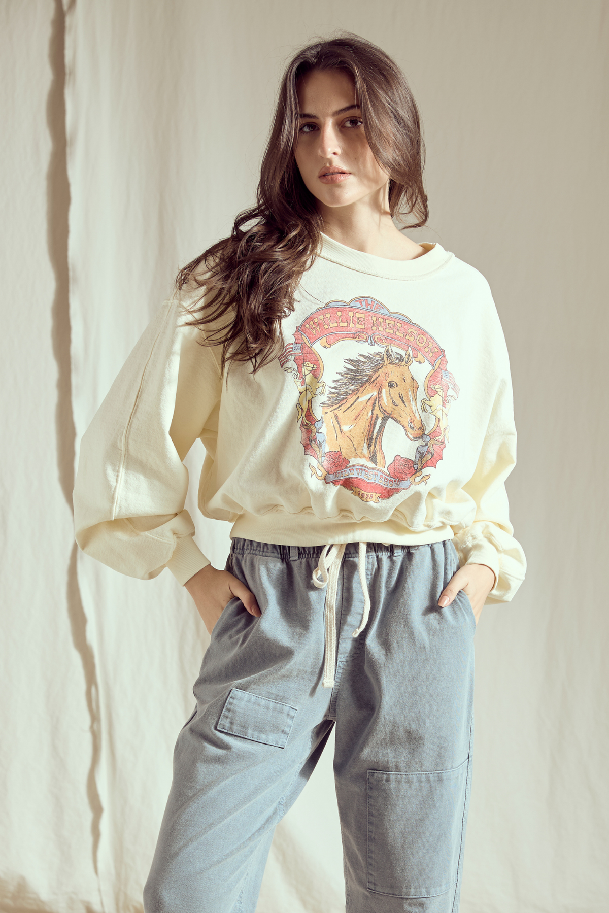 Willie Nelson Wild West women’s sweatshirt by People of Leisure featuring a western-themed design on soft fabric.