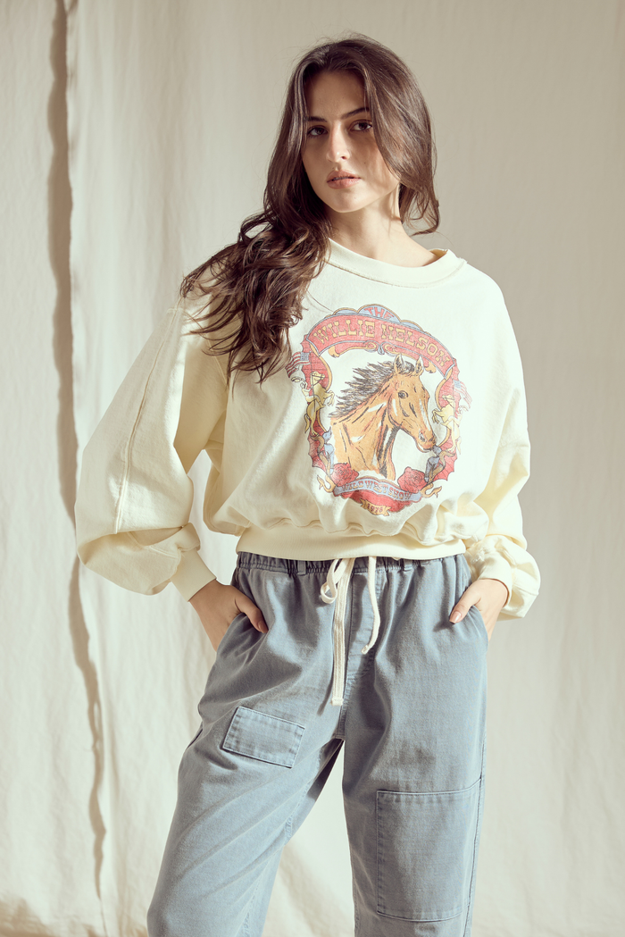 Willie Nelson Wild West women’s sweatshirt by People of Leisure featuring a western-themed design on soft fabric.