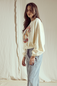 Willie Nelson Wild West women’s sweatshirt by People of Leisure featuring western-themed design on cozy fabric.