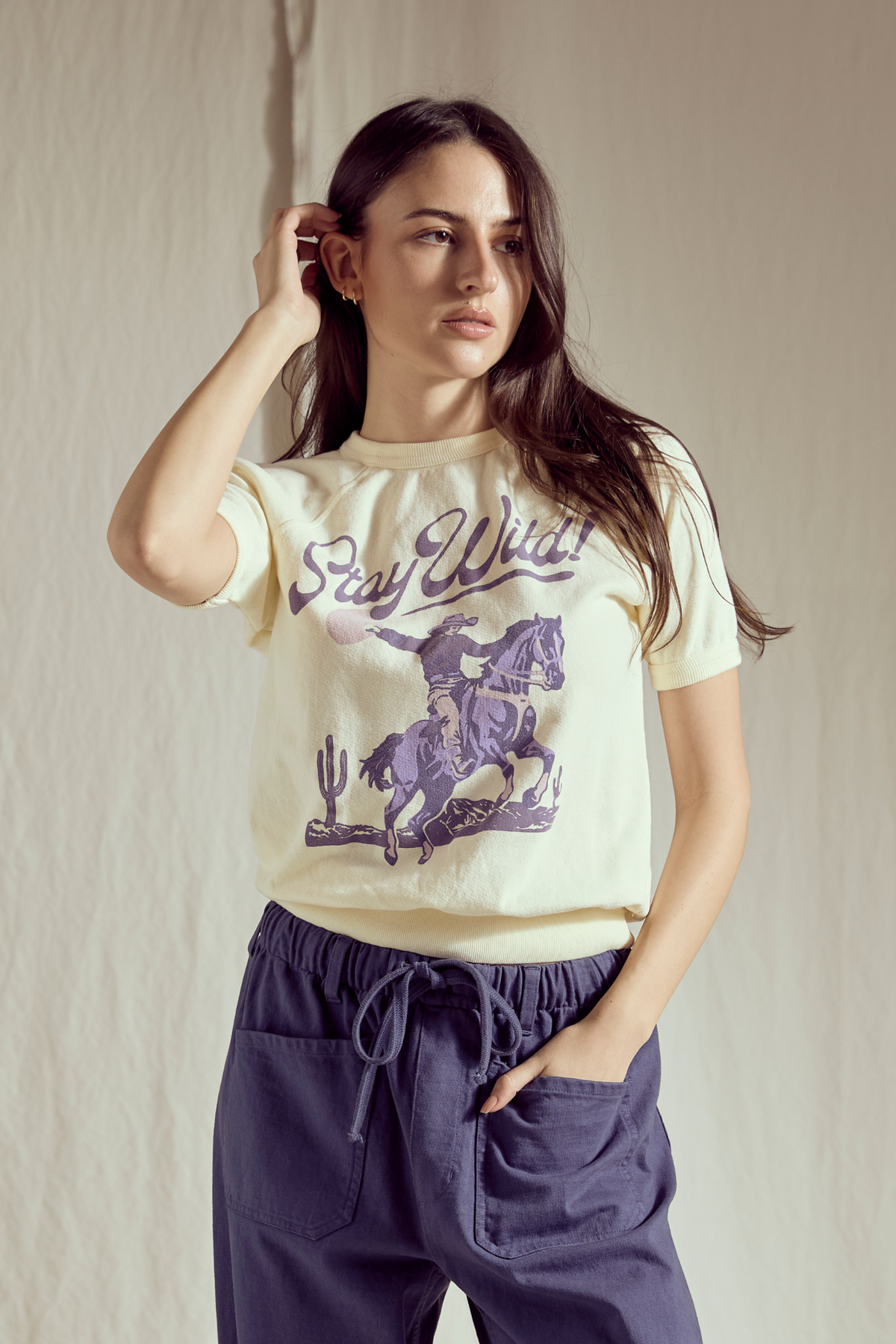 Women’s Stay Wild Raglan Summer Top by People of Leisure, lightweight casual top with short sleeves and graphic design.