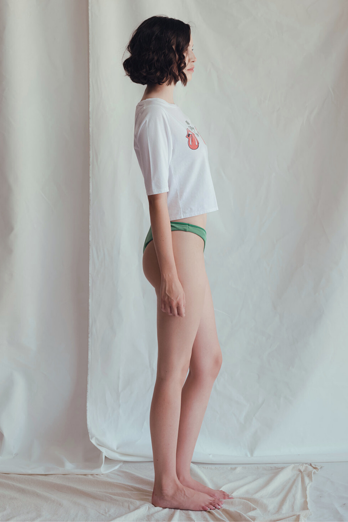 Women’s crop tee featuring Rolling Stones "Start Me Up" graphic by People of Leisure, casual streetwear style.