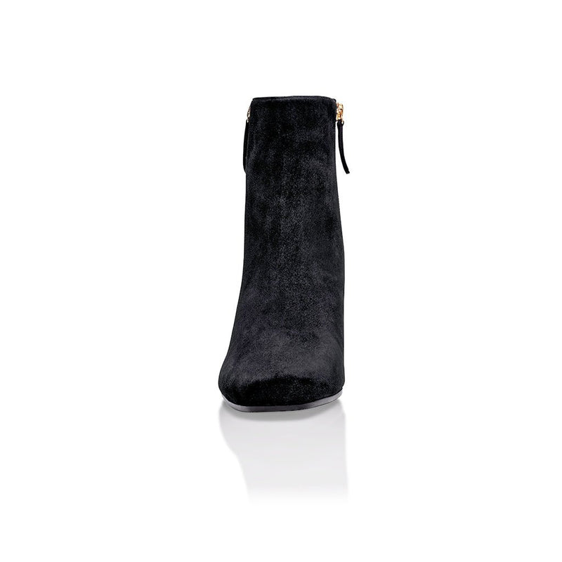 Black suede Arina ankle bootie with a block heel from Joan Oloff Shoes, featuring a stylish and modern design.