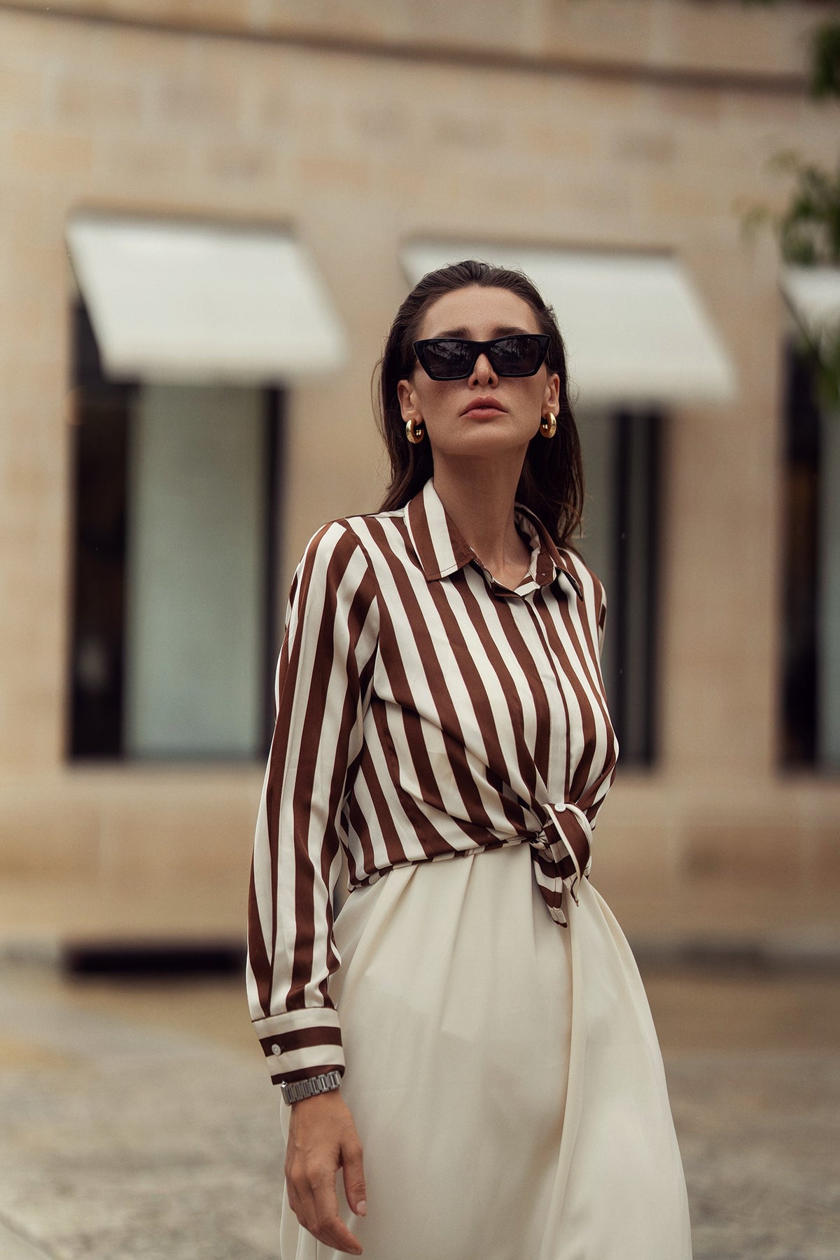 Striped silky blouse by Profile NYC, featuring a stylish design with soft fabric and classic collar, perfect for elegant casual wear.