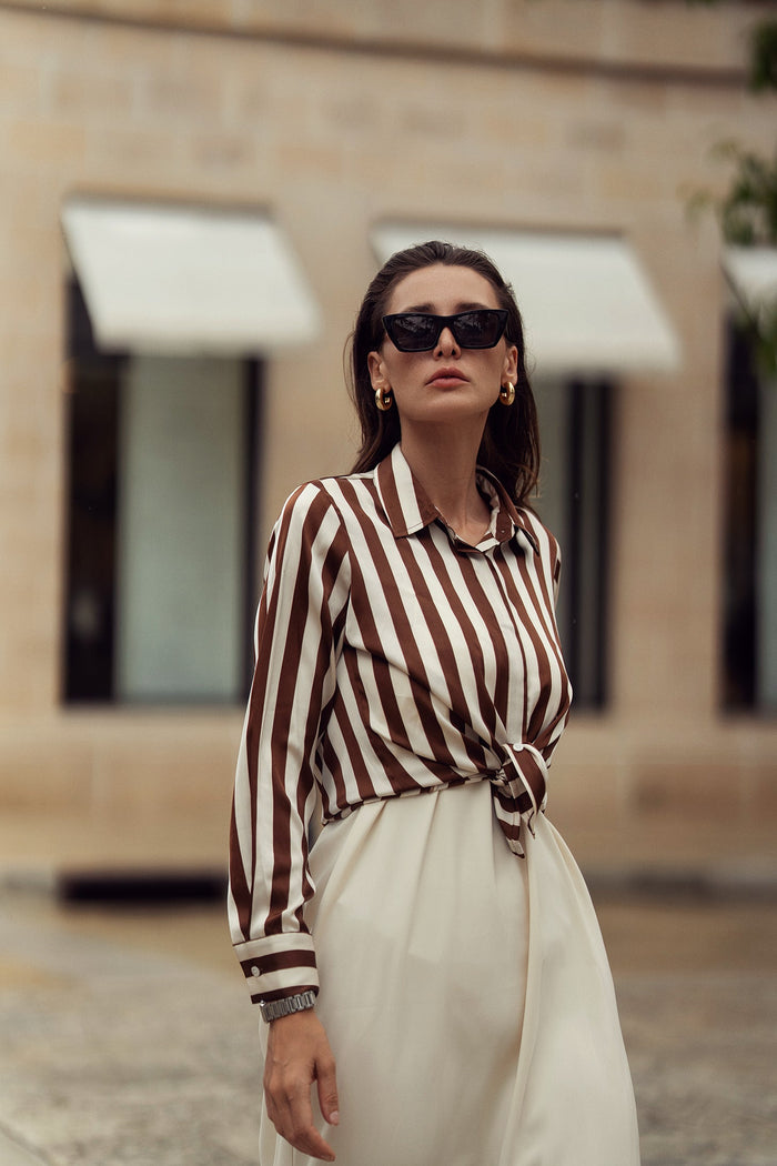 Striped silky blouse by Profile NYC, featuring a stylish design with soft fabric and classic collar, perfect for elegant casual wear.