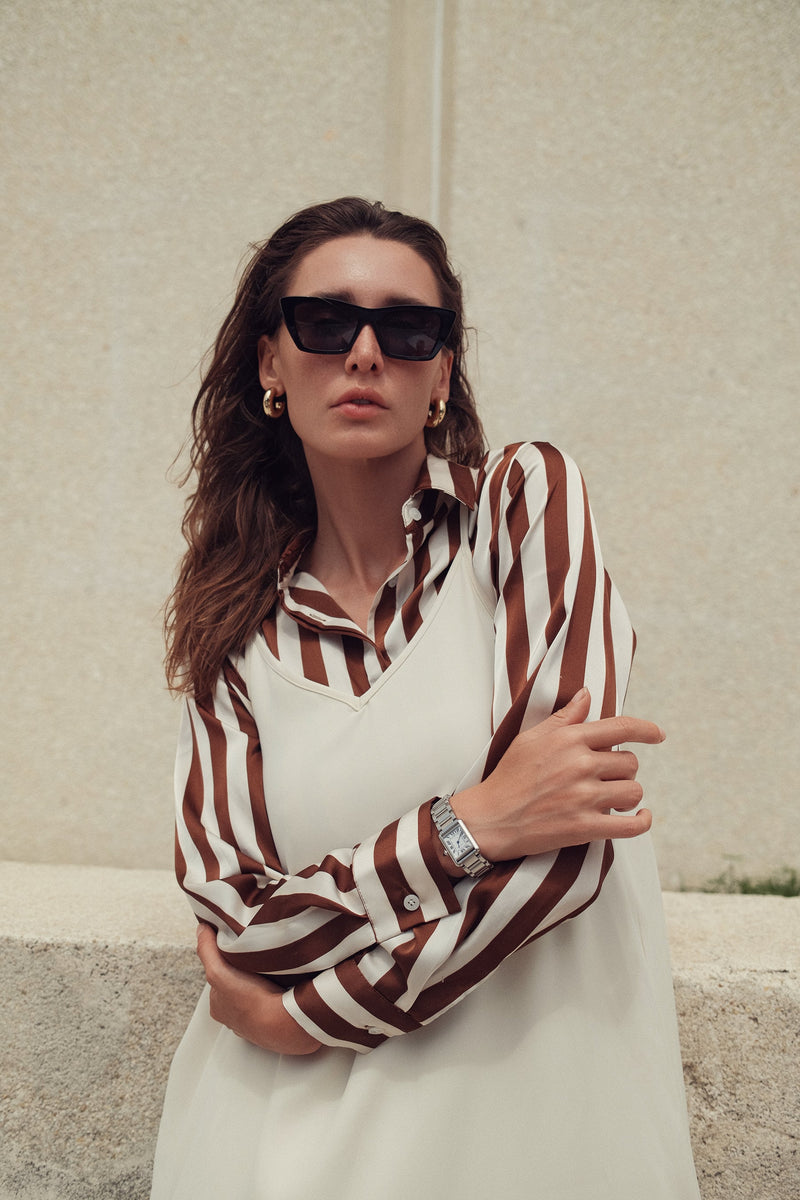 Striped silky blouse from Profile NYC featuring a stylish design, lightweight fabric, and a relaxed fit.