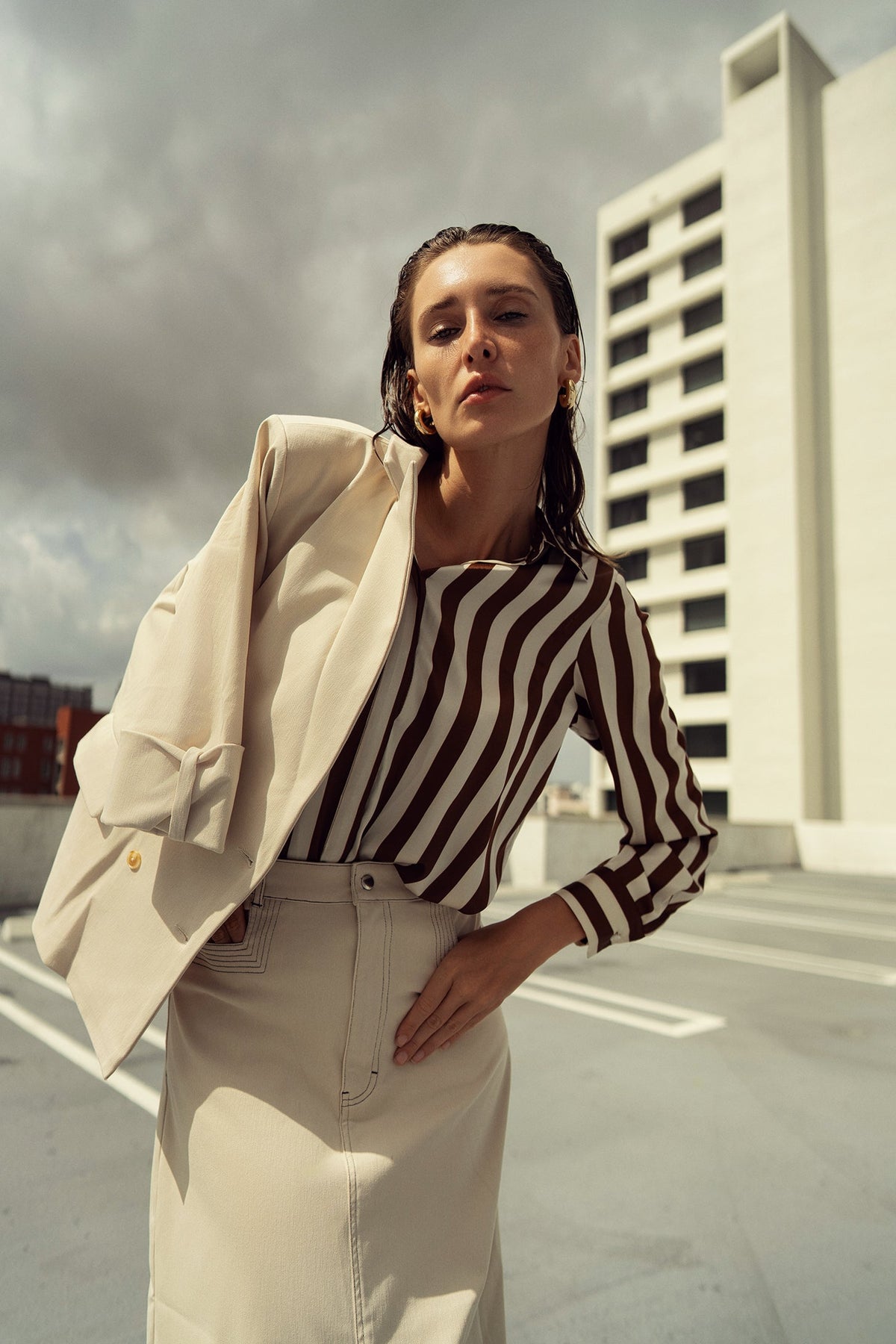 Striped silky blouse by Profile NYC, featuring a stylish design with soft fabric and a modern fit, perfect for versatile office or casual wear.