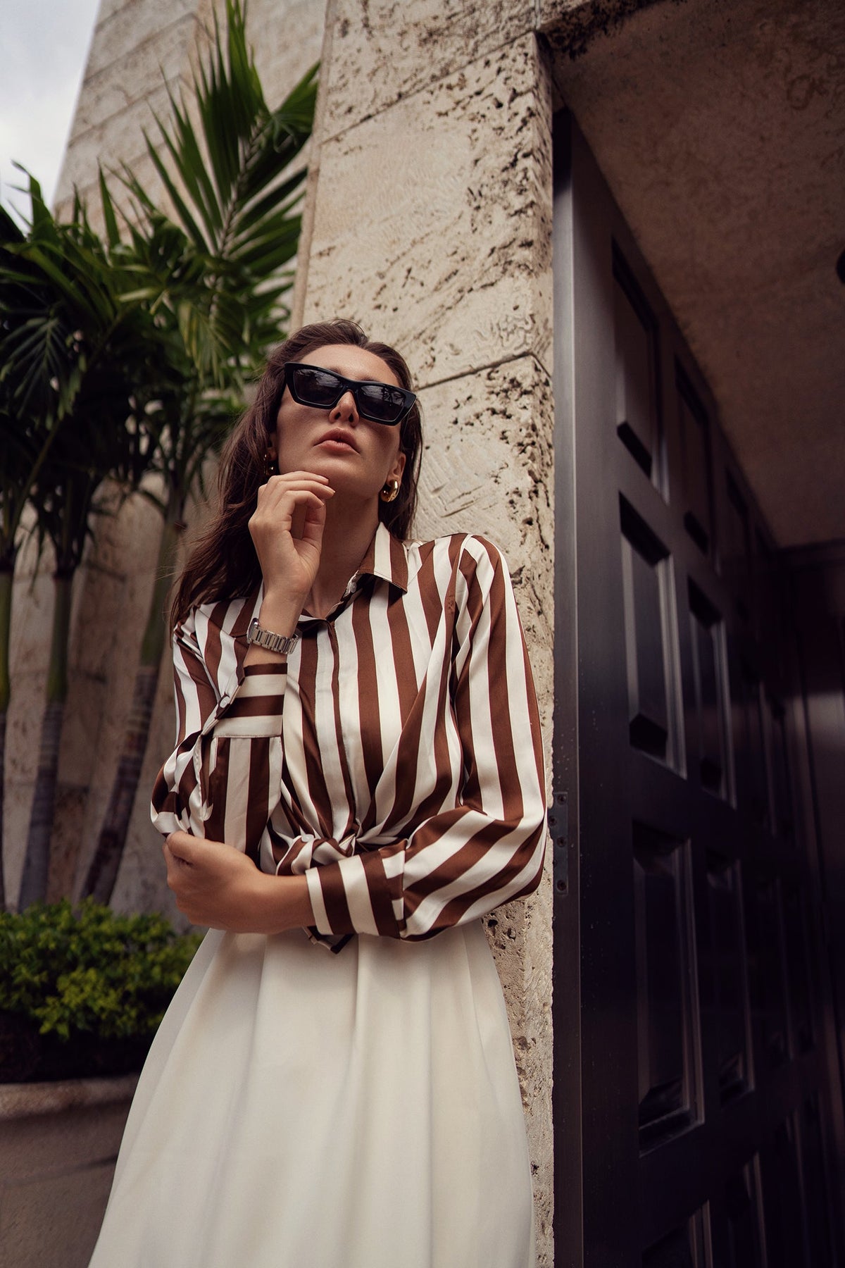 Striped silky blouse by Profile NYC, featuring a stylish design with soft fabric, shown on a model.