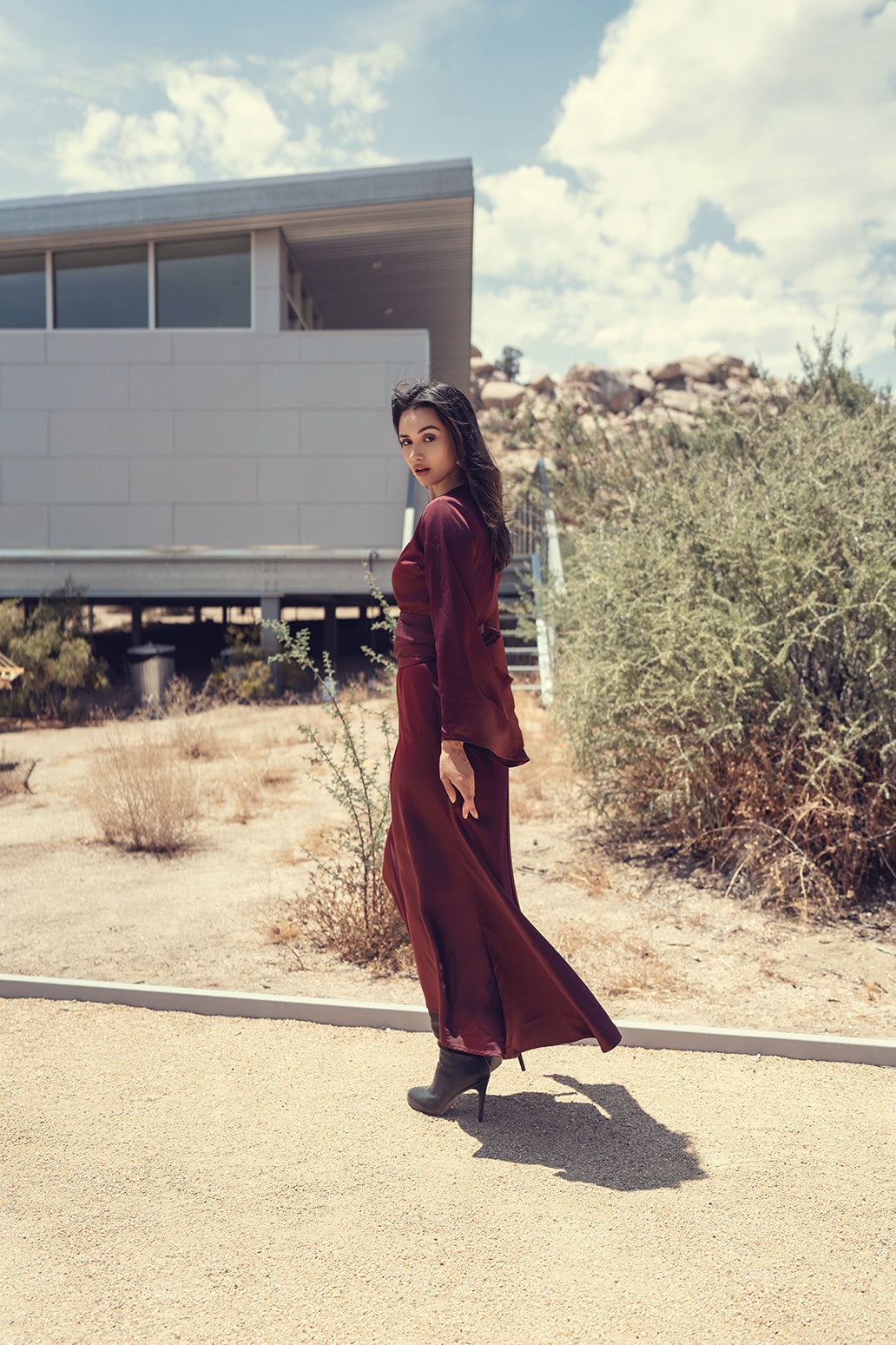 Black bell sleeve dress by Profile NYC featuring a stylish silhouette and fitted design, perfect for casual or semi-formal occasions.