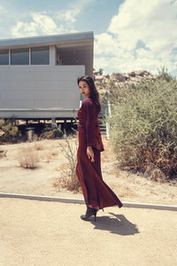 Black bell sleeve dress by Profile NYC featuring a stylish silhouette and fitted design, perfect for casual or semi-formal occasions.