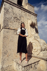 Elegant silk jumper dress by profile-nyc featuring a smooth, flowing fabric and a stylish, contemporary design.
