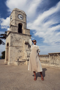Elegant silk jumper dress by Profile NYC, featuring a smooth, flowing fabric and a stylish, modern design.