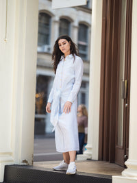 Striped front tie dress from Profile NYC featuring a stylish design and lightweight fabric, perfect for casual or summer wear.
