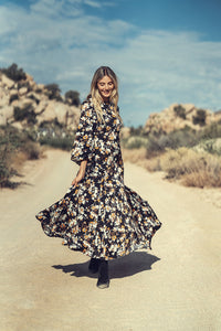 Floral dress by profile-nyc featuring a vibrant pattern, sleeveless design, perfect for spring and summer occasions.