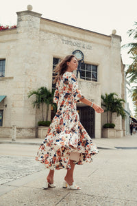 Floral piping dress by profile-nyc featuring a fitted silhouette with vibrant floral patterns and elegant design details.