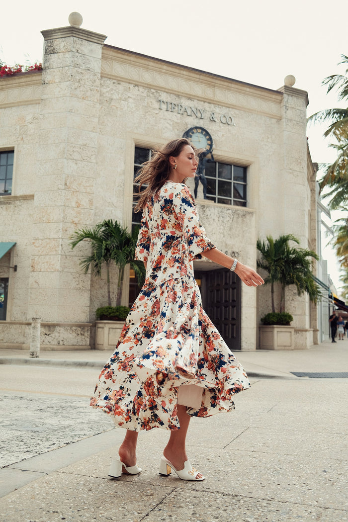 Floral piping dress by profile-nyc featuring a fitted silhouette with vibrant floral patterns and elegant design details.