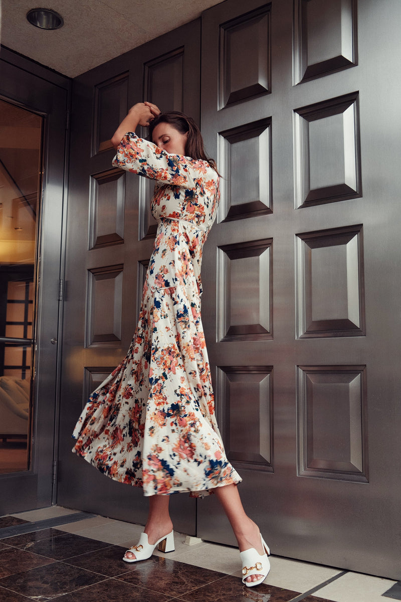 Floral piping dress by profile-nyc featuring a fitted bodice, vibrant floral pattern, and flowing skirt, perfect for spring wear.