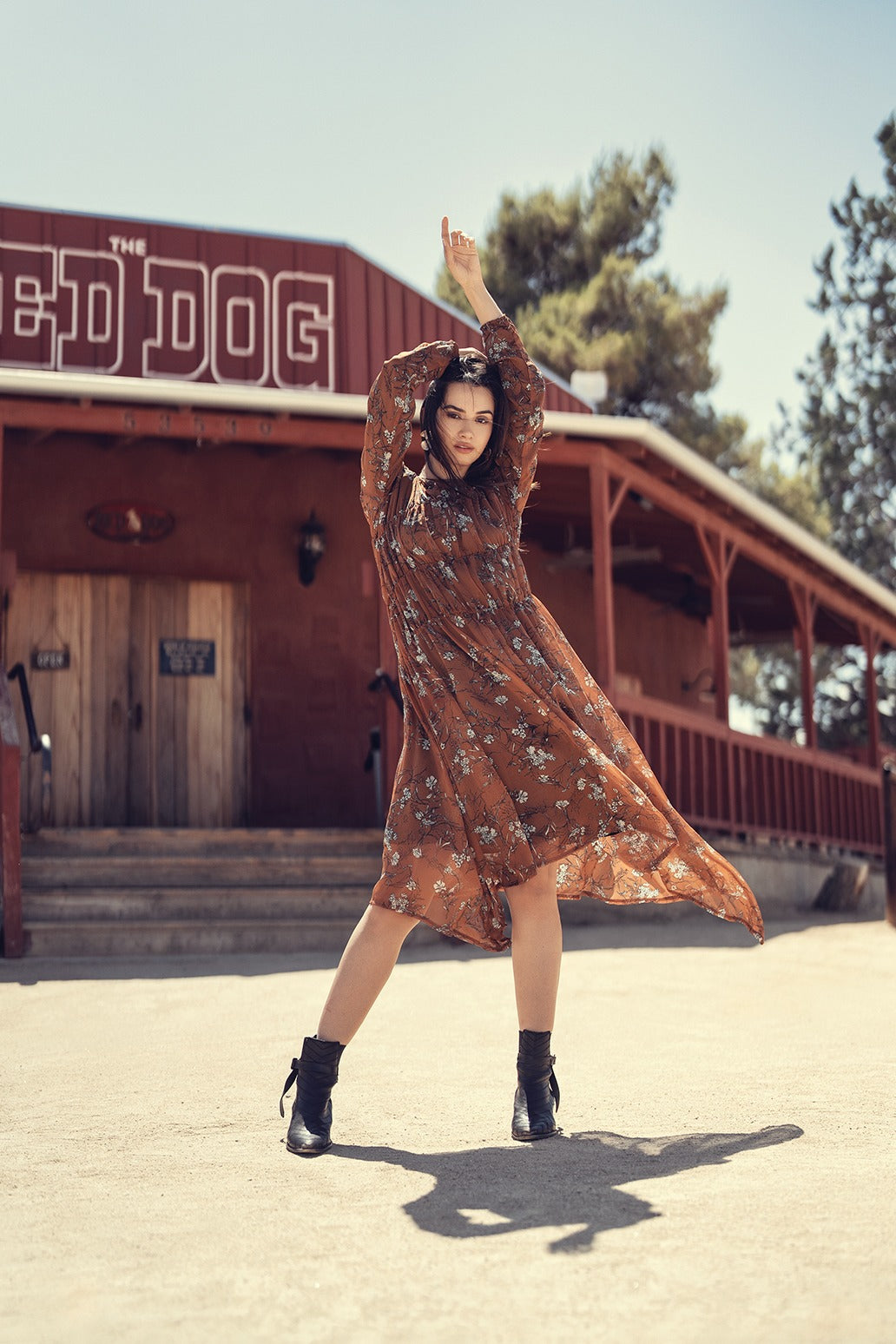 Floral rust-colored dress by profile-nyc featuring a stylish, flowy design with floral patterns, perfect for casual or semi-formal wear.