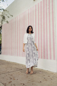 Navy paisley jumper dress by profile-nyc featuring a stylish, patterned fabric and a comfortable, casual fit.