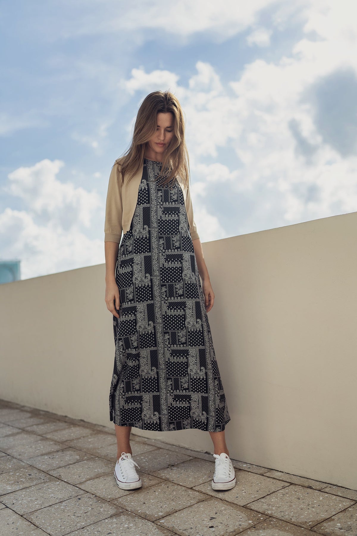Navy paisley jumper dress by profile-nyc, featuring a stylish pattern and comfortable fit, displayed on a mannequin.